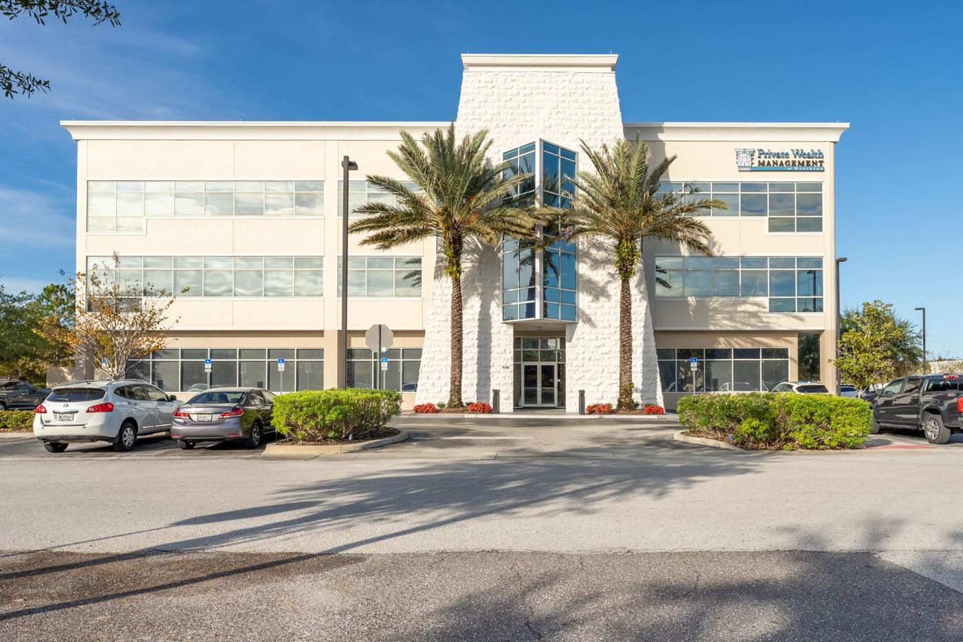 Front entry of 1540 International Parkway with palms
