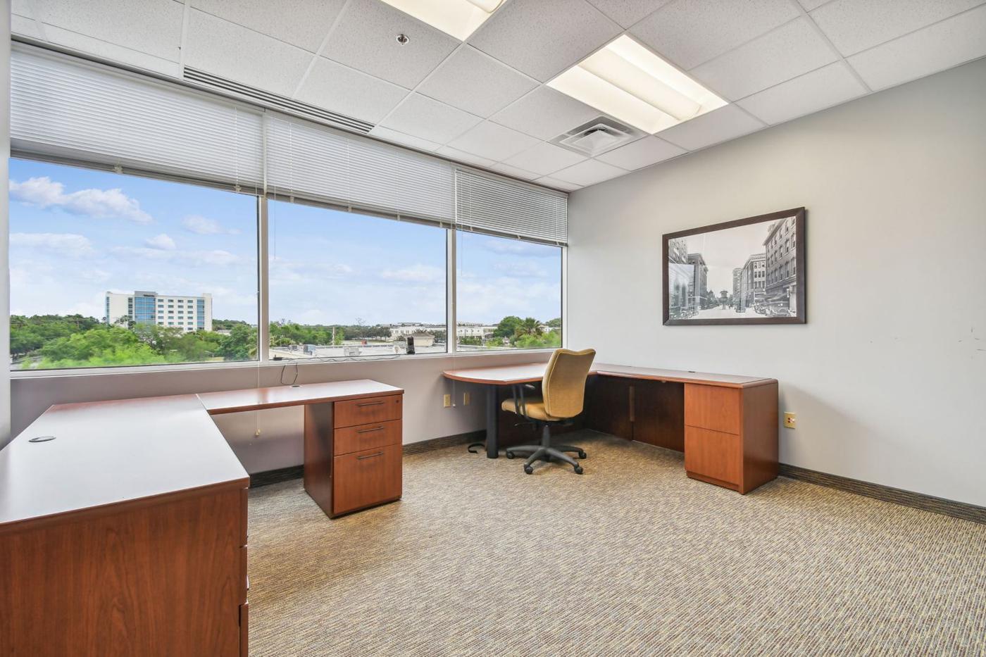 Suite 3050: corner room with a wall of windows