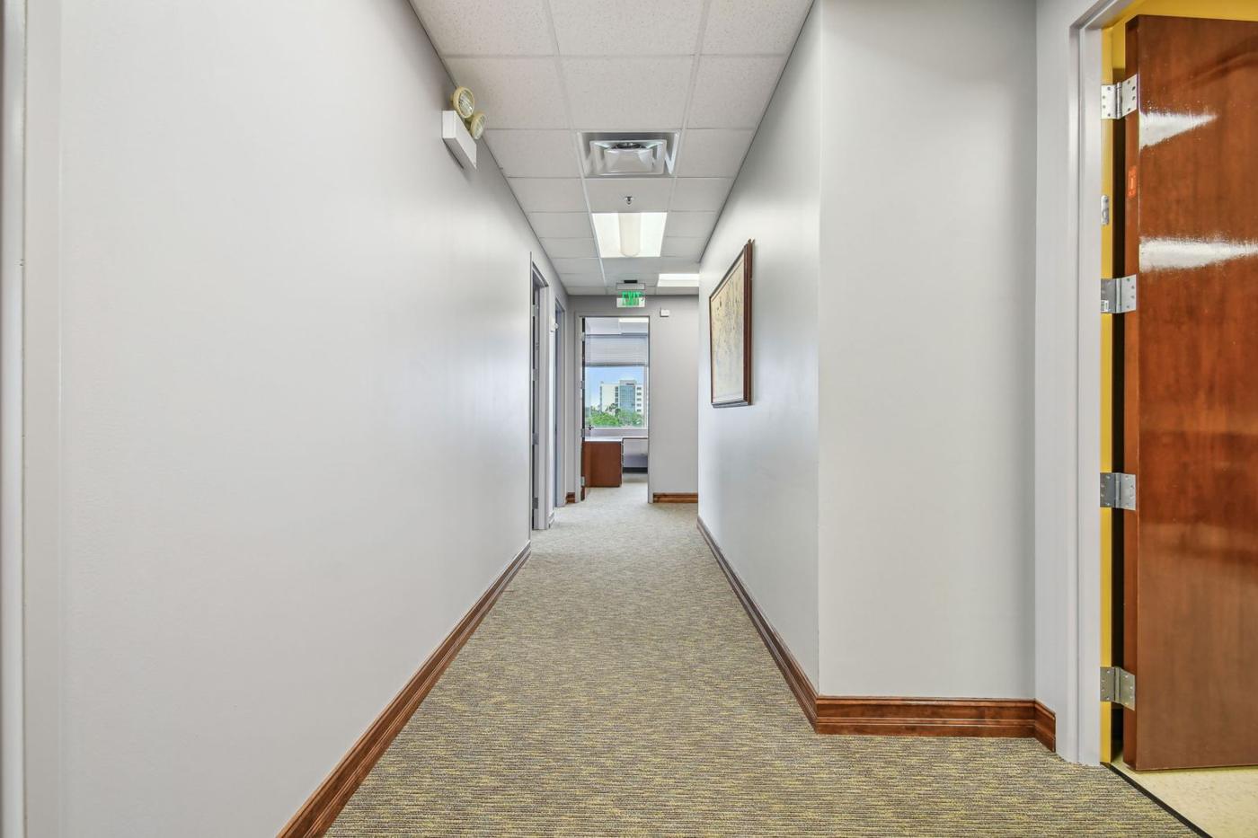 Suite 3050: interior hallway with wood doors