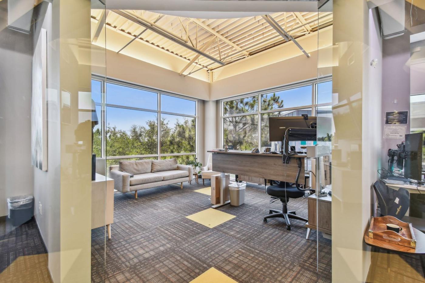 Suite 3060: glass-fronted corner room with windows on two sides